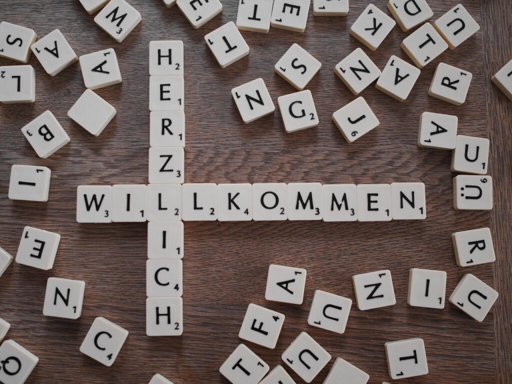 Herzlich Willkommen mit Scrabble Spielsteinen gelegt